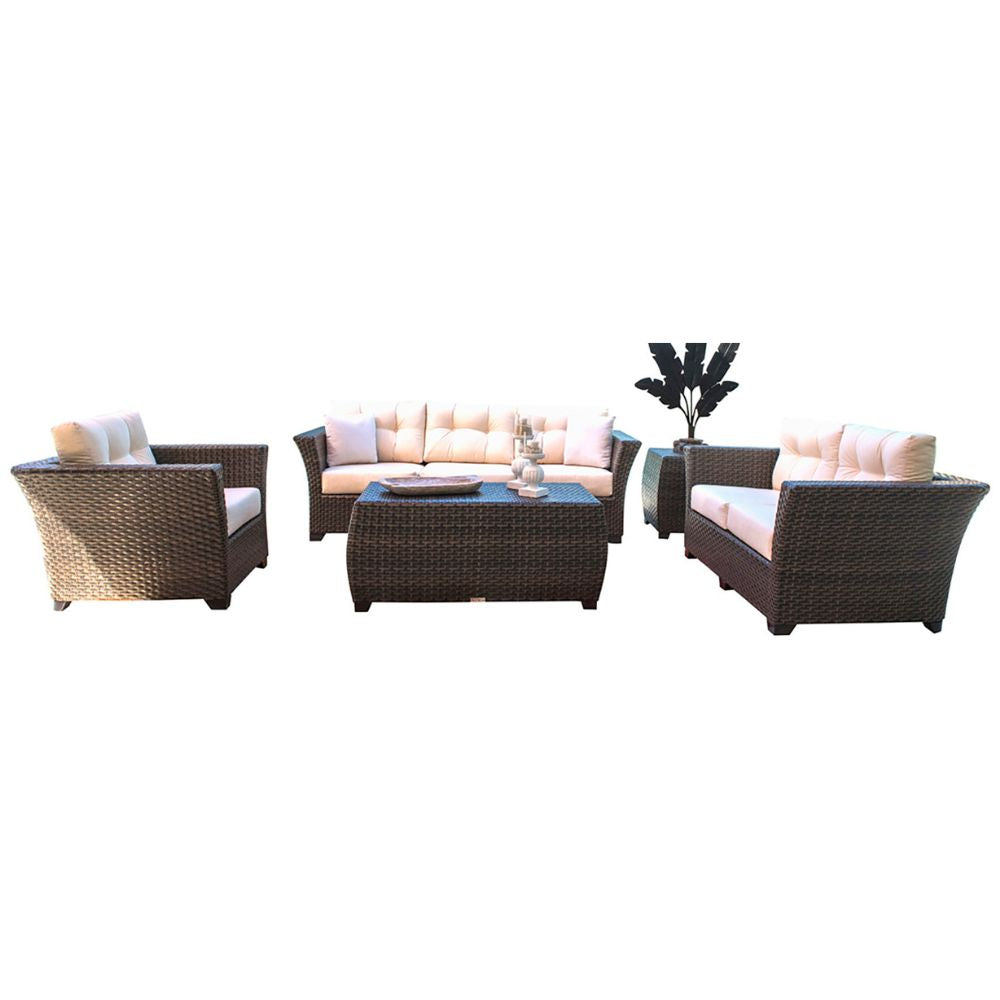 Outdoor furniture set with wicker chairs and a table on a white background