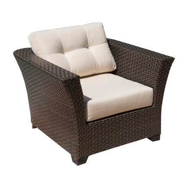 Wicker armchair with beige cushions on a white background