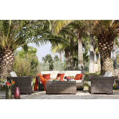 Outdoor patio set with palm trees in the background