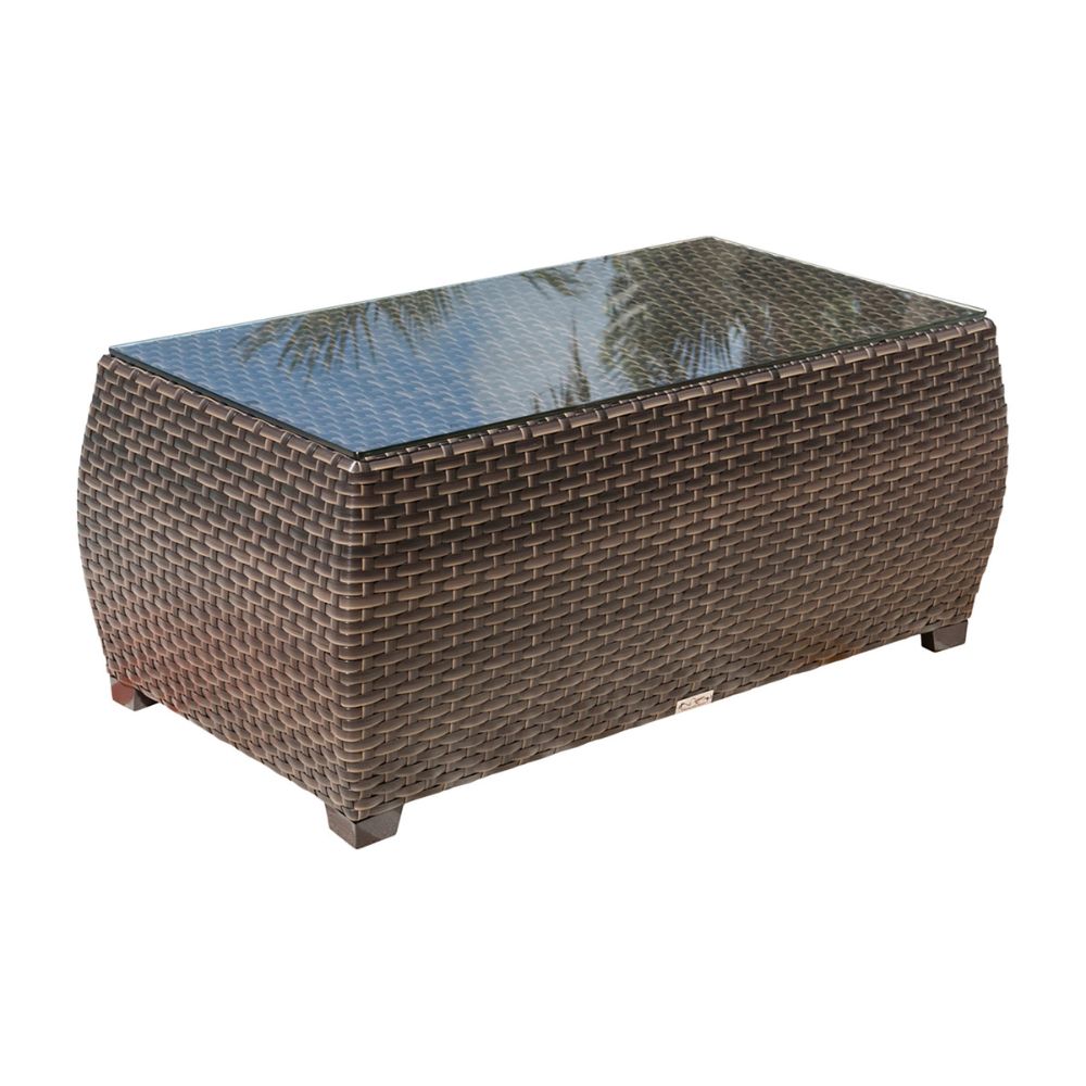 Wicker coffee table with glass top on a white background