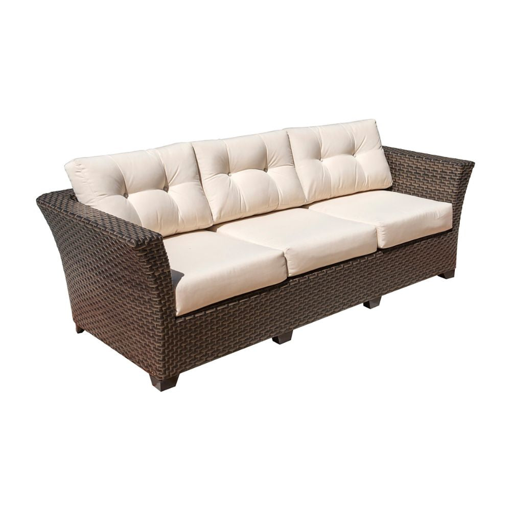 Wicker outdoor sofa with beige cushions on a white background