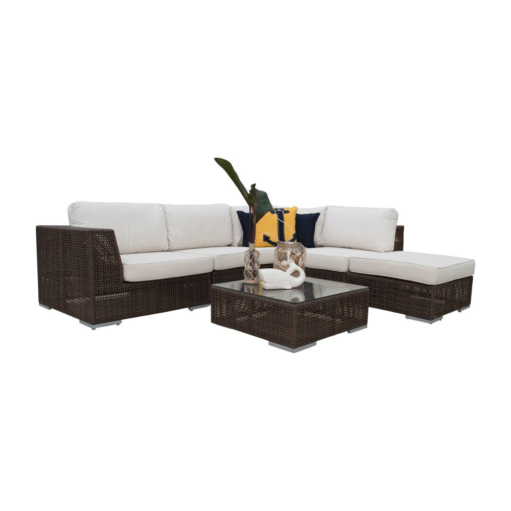 Outdoor furniture set with a sectional sofa and coffee table on a white background