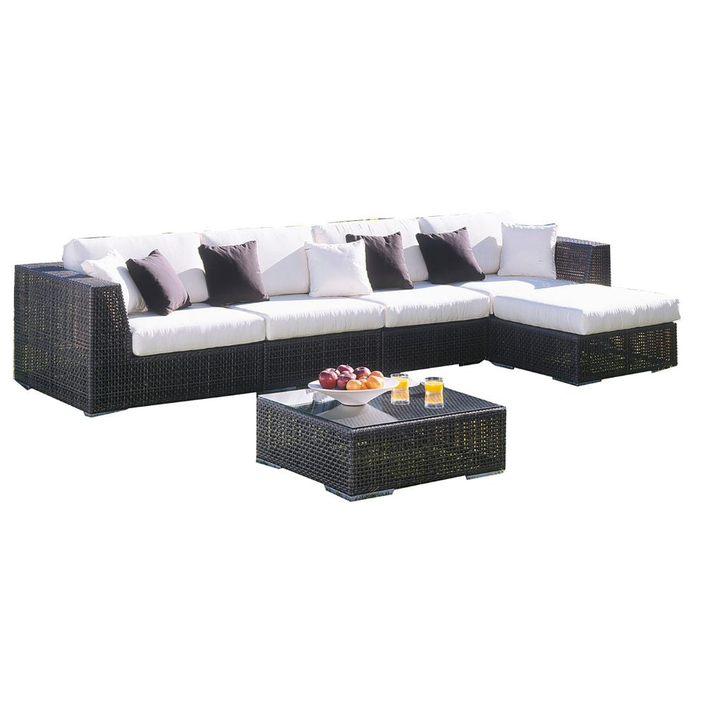 Sectional outdoor sofa with cushions and a coffee table on a white background