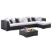 Sectional outdoor sofa with cushions and a coffee table on a white background