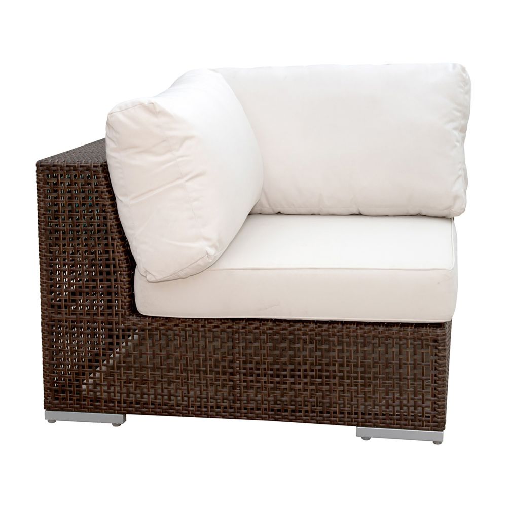 Brown wicker chair with white cushions on a white background