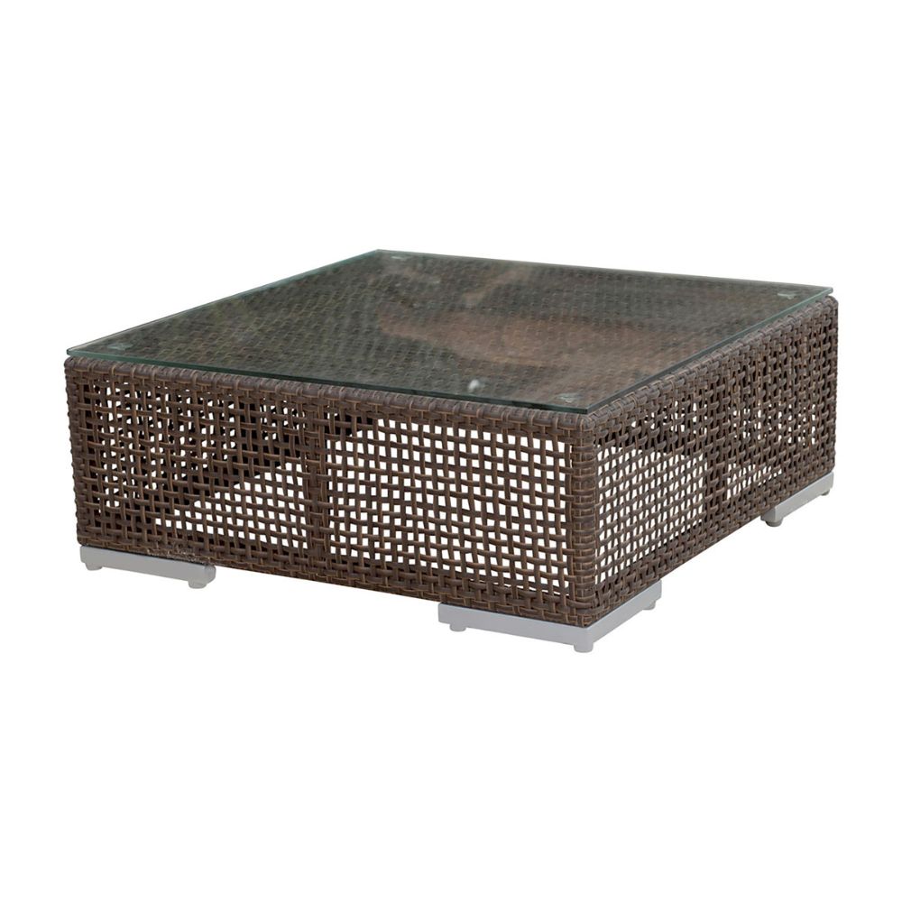 Wicker coffee table with glass top on a white background