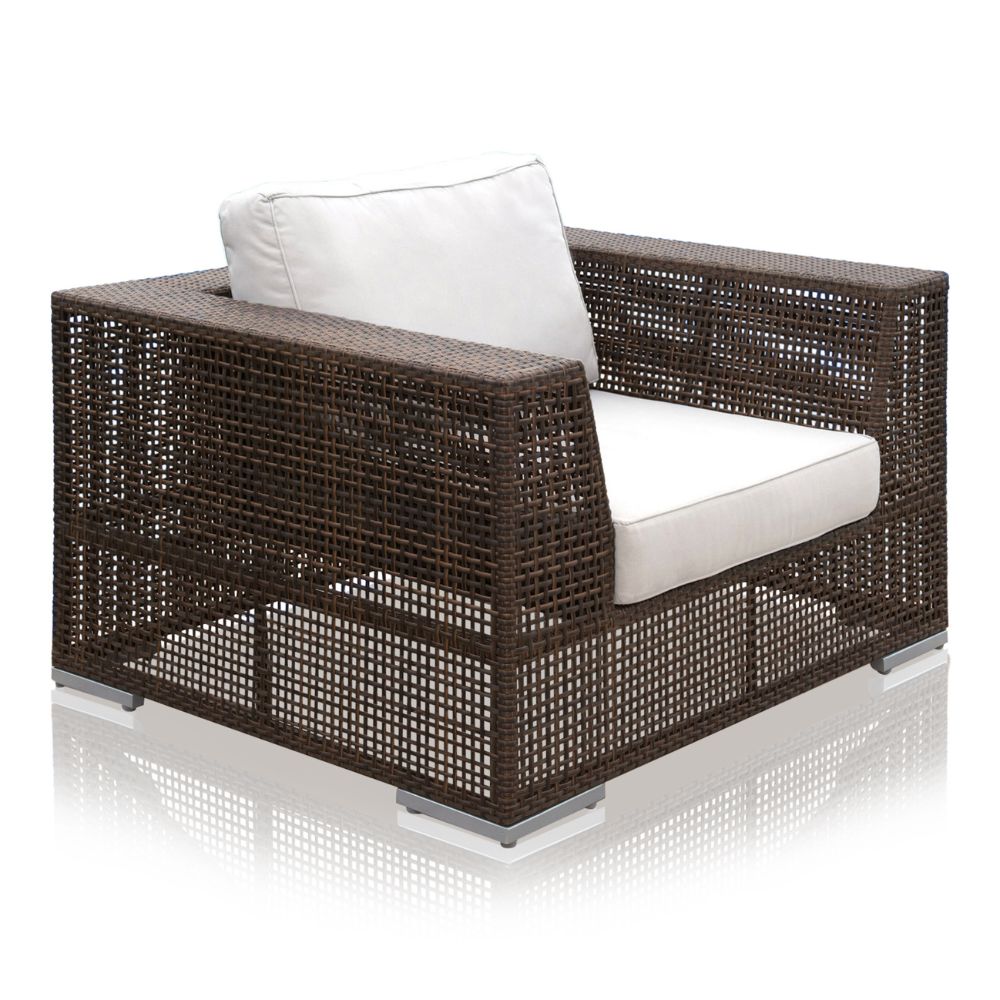 Wicker outdoor chair with white cushions on a white background