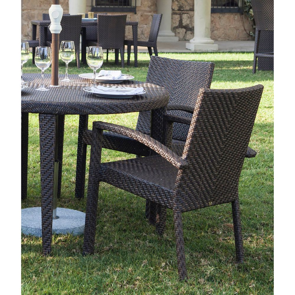 Outdoor dining set with chairs and table on grass