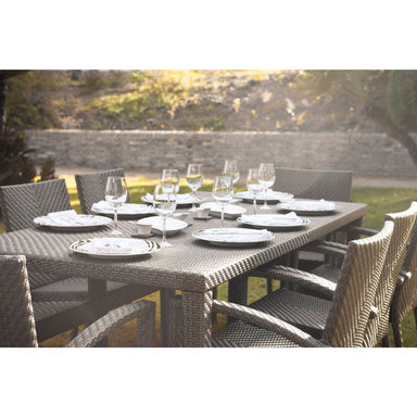 Outdoor dining set with table and chairs in a garden setting
