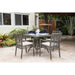 Outdoor patio set with table and chairs on a patio area.
