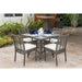 Outdoor patio set with table and chairs on a stone patio