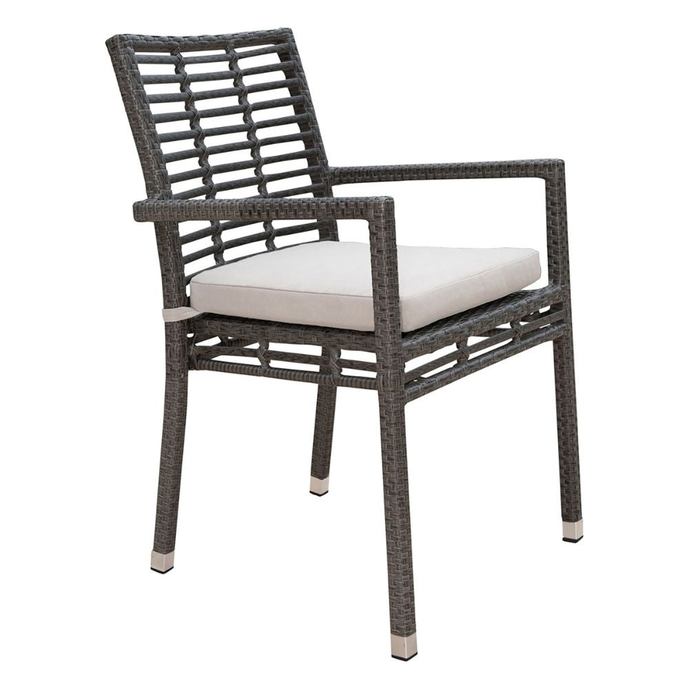 Wicker chair with a white cushion on a white background