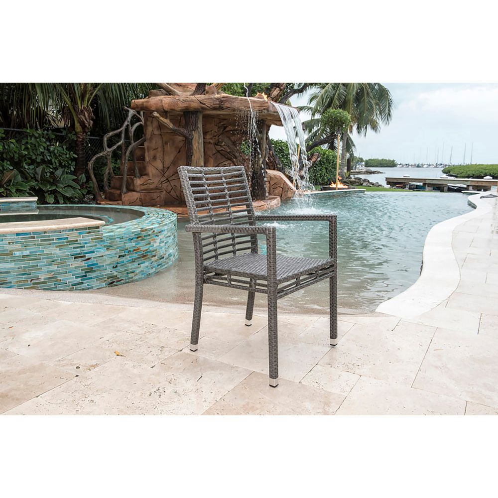 Chair by a pool with a fountain and scenic background