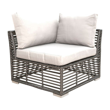 Corner outdoor sofa with wicker frame and white cushions on a white background