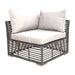 Corner outdoor sofa with wicker frame and white cushions on a white background
