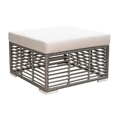 Wicker outdoor ottoman with a white cushion on a white background