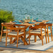 Wooden outdoor dining set with chairs and table by a body of water
