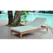Wooden lounge chair with light blue cushion by a poolside