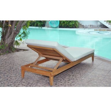 Wooden lounge chair with white cushion by a poolside