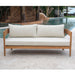 Wooden outdoor sofa with white cushions by a poolside