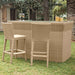 Wicker outdoor bar set with stools on a grassy area