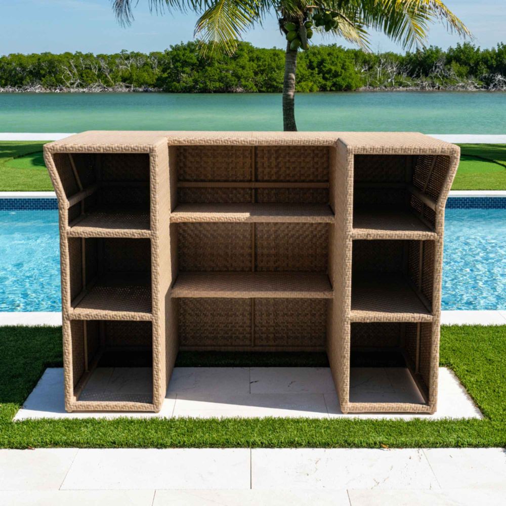 Wicker outdoor cabinet by a pool with greenery in the background