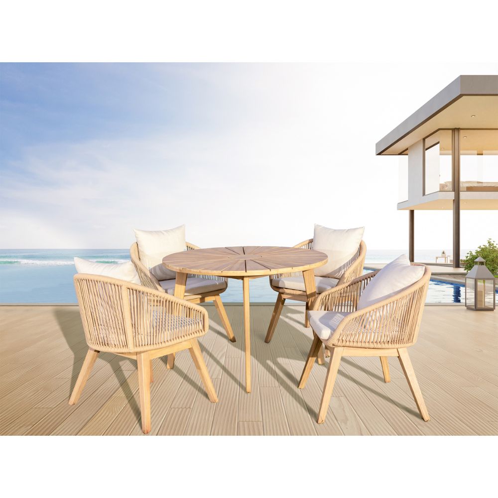 Outdoor furniture set with a round table and four chairs on a deck with a pool and ocean view.