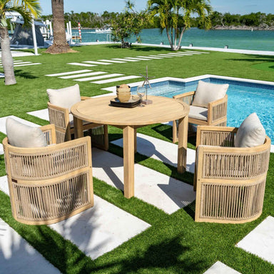 Outdoor patio set with wooden table and chairs by a poolside.