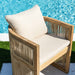 Wooden outdoor chair with beige cushions by a pool