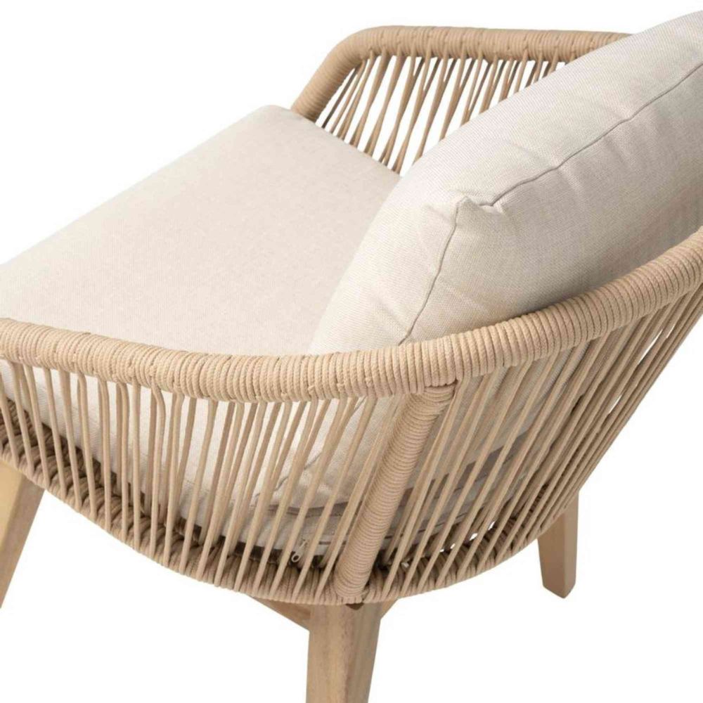 Wicker chair with beige cushions on a white background