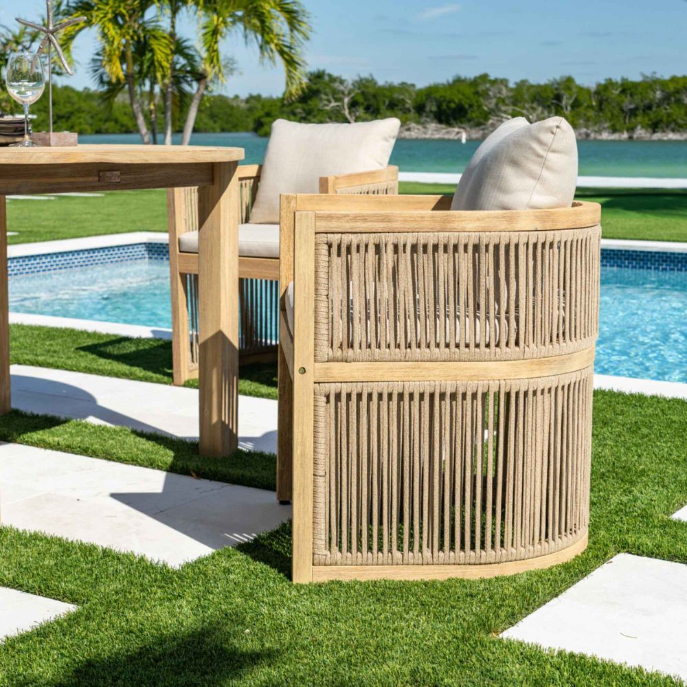 Outdoor furniture set with a side table by a poolside