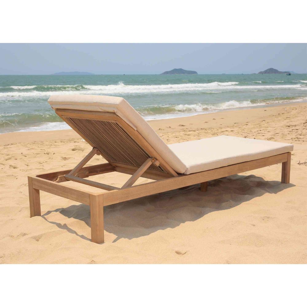 Beach chair on a sandy beach with ocean in the background