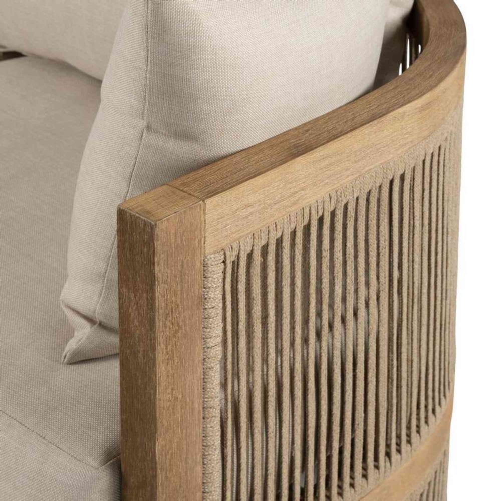 Close-up of a wooden chair with woven backrest against a beige cushioned background