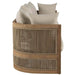 Wooden basket with woven design containing beige pillows on a white background