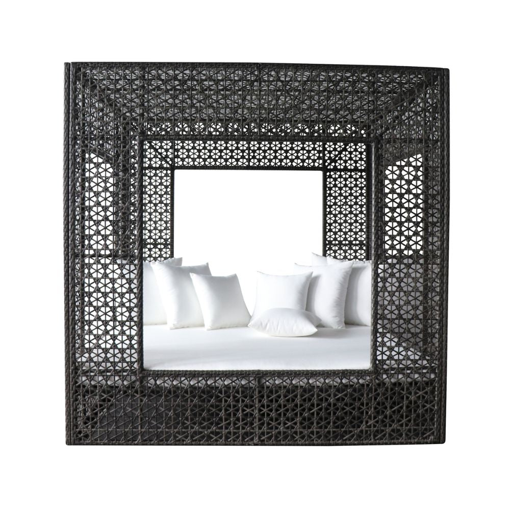 Woven black frame around a bed with white bedding on a white background