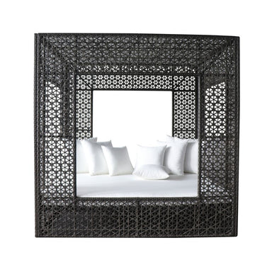 Woven black frame around a bed with white bedding on a white background