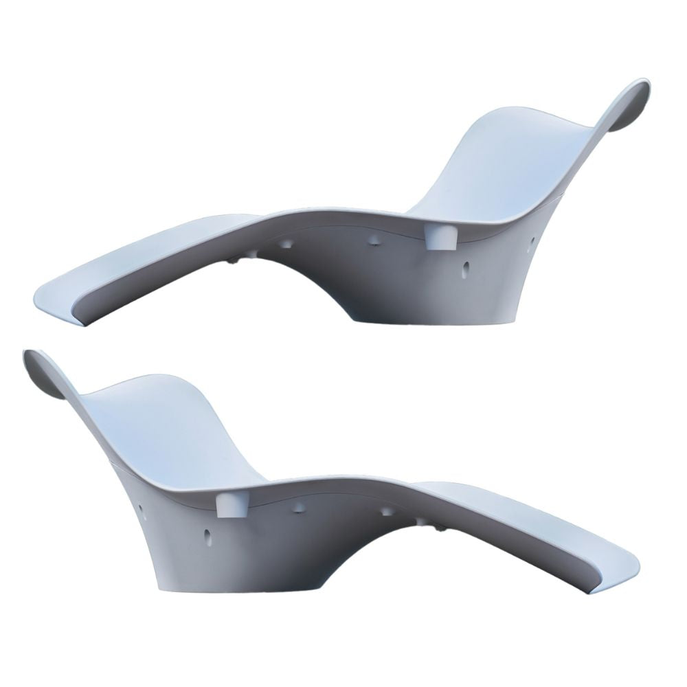 Two white curved chairs on a white background