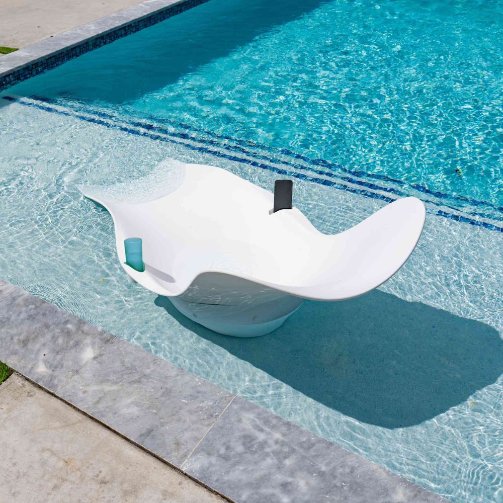White floating device in a pool with clear blue water