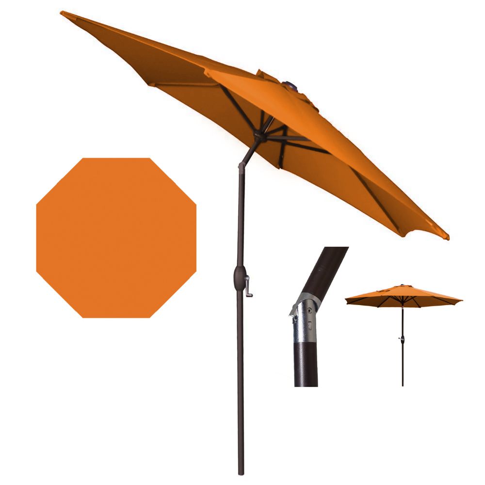Orange patio umbrella with stand and parts on a white background