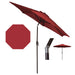 Red patio umbrella with stand and parts on a white background