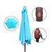 Blue patio umbrella with brown stand on a white background