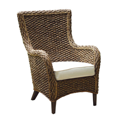 Woven armchair with a white cushion on a white background