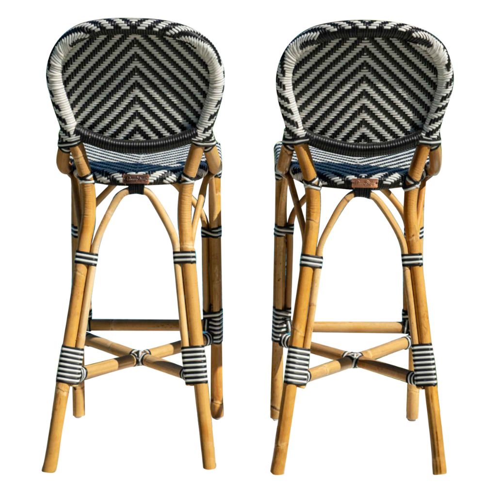 Two bar stools with wicker frames and chevron-patterned seats on a white background