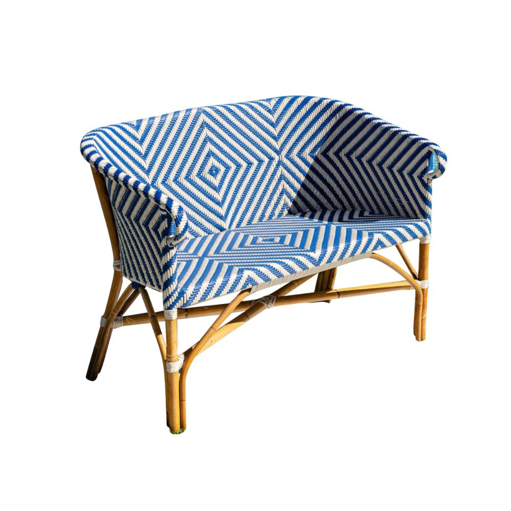 Bamboo bench with blue and white patterned cover on a white background
