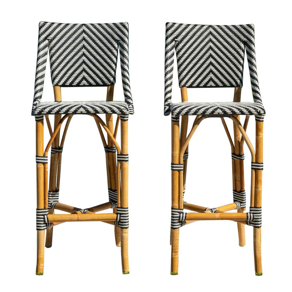 Two rattan bar stools with striped cushions on a white background