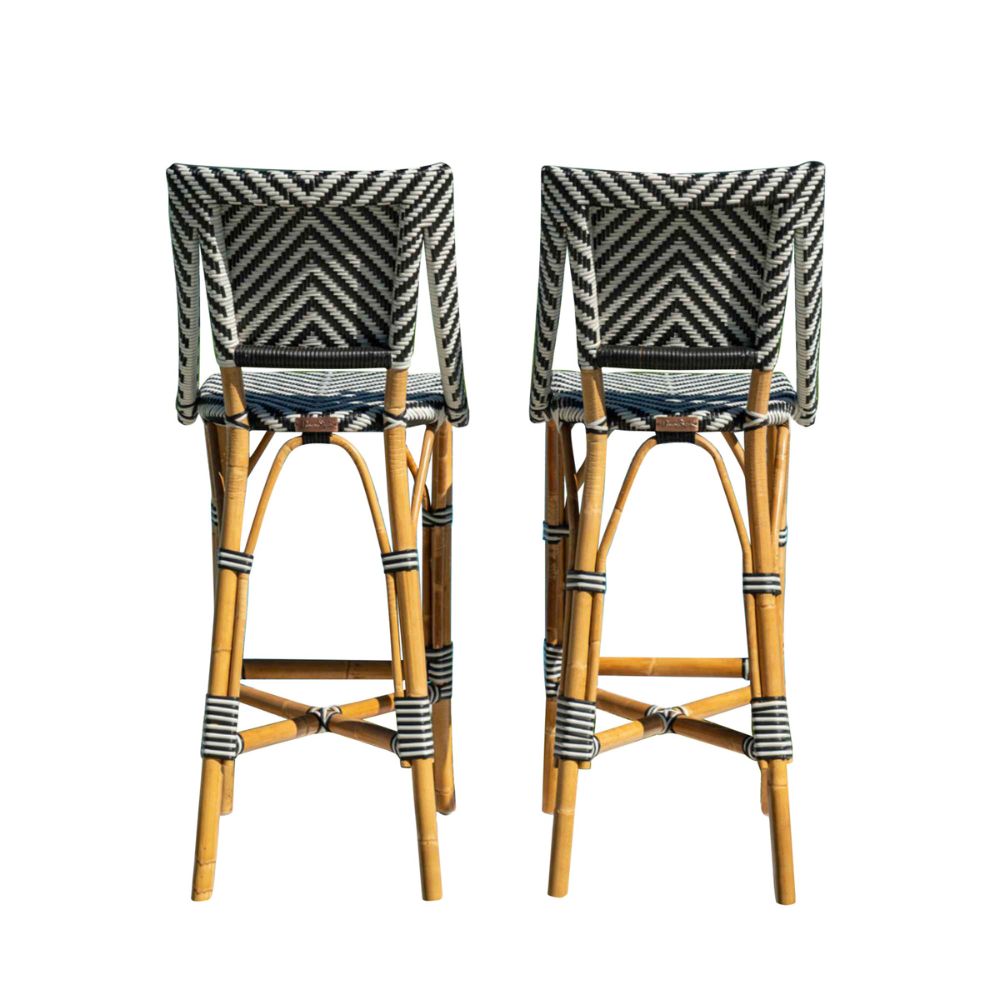Two bar stools with wicker frames and striped backrests on a white background