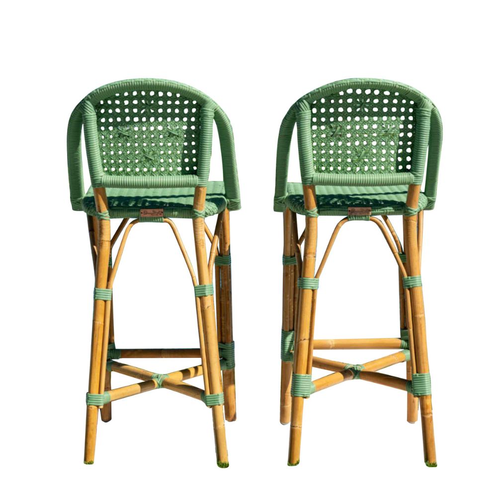 Two green and brown wicker bar stools on a white background