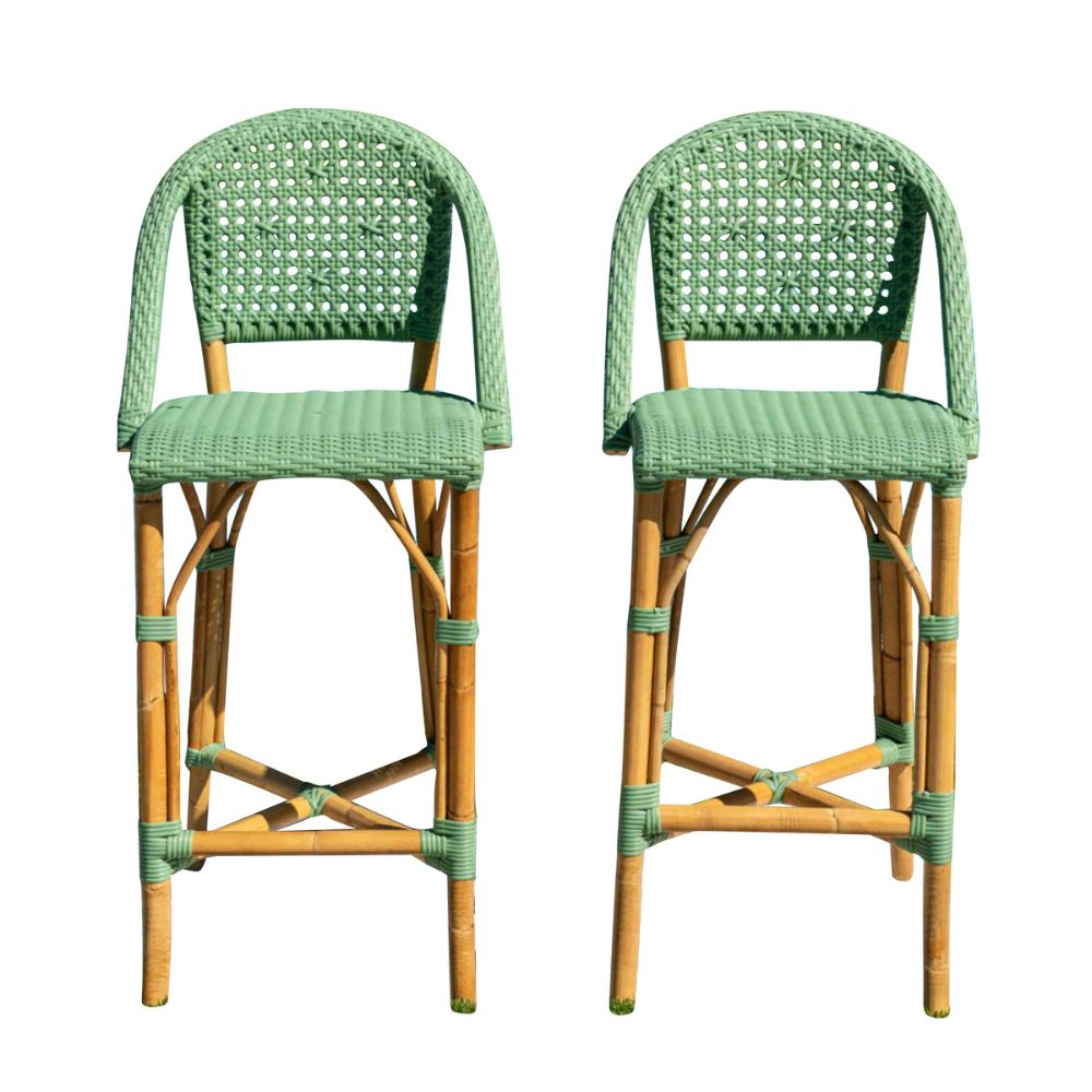Two green wicker bar stools on a white background