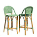 Two green and brown wicker bar stools on a white background