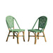 Two green wicker chairs on a white background